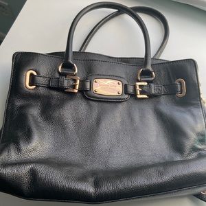 Michael kors black pocketbook with gold accents. In great condition